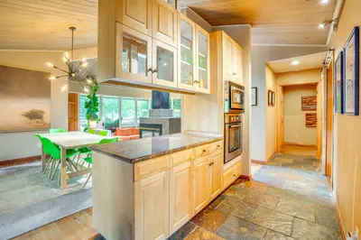 a kitchen with a table and a dining room at Mtn-View Frisco Home Near Skiing and Hiking! in Frisco
