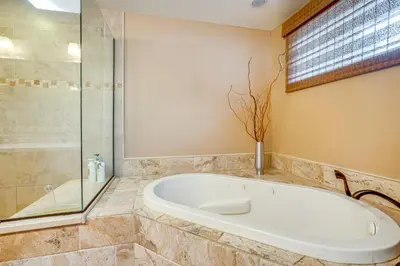 a bathroom with a tub and a glass shower at Mtn-View Frisco Home Near Skiing and Hiking! in Frisco