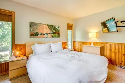 a bedroom with a large white bed and a window at Mtn-View Frisco Home Near Skiing and Hiking! in Frisco