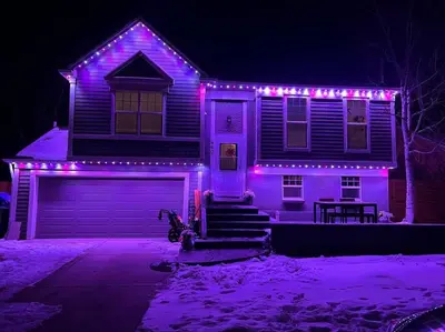a house with purple lights on the front of it at Hot Tub Steam Shower Gym in Charming Family Home! in Lafayette