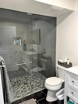 a bathroom with a shower and a toilet at Hot Tub Steam Shower Gym in Charming Family Home! in Lafayette