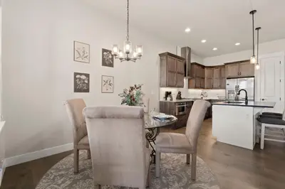 a kitchen and dining room with a table and chairs at Scenic Mountain Retreat Golf, Pickleball, Relax in Loveland