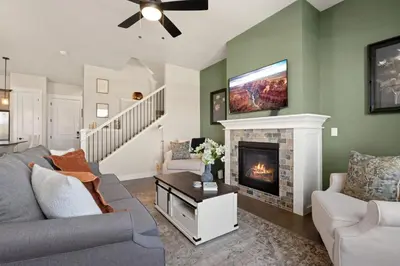 a living room with a couch and a fireplace at Scenic Mountain Retreat Golf, Pickleball, Relax in Loveland
