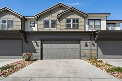 a large house with a garage at Scenic Mountain Retreat Golf, Pickleball, Relax in Loveland