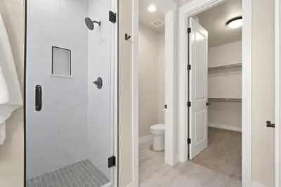 a bathroom with a shower and a toilet at Scenic Mountain Retreat Golf, Pickleball, Relax in Loveland
