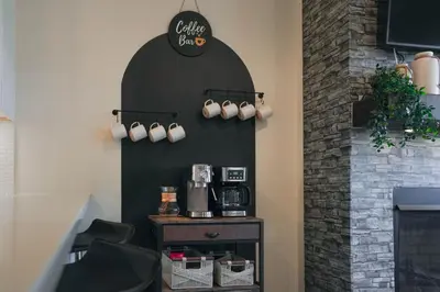 a coffee shop with a coffee bar on the wall at WinterPark, Ski, CoffeeBar, Pets and CommunalHotTub in Winter Park