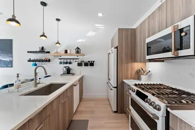 a kitchen with a sink and a stove top oven at River West 635 in Silverthorne