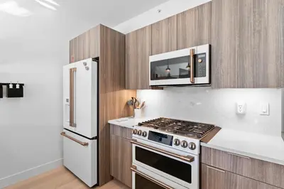 a kitchen with a stove and a refrigerator at River West 635 in Silverthorne