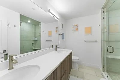 a bathroom with two sinks and a shower at River West 635 in Silverthorne