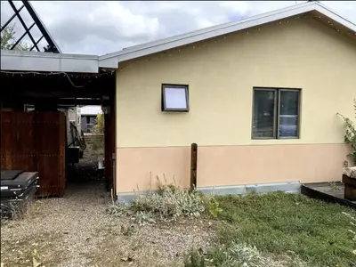 a house with a window on the side of it at Energy-Efficient Oasis Cozy Near DT Boulder and trails in Boulder