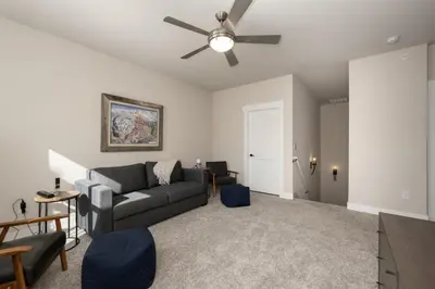 a living room with a couch and a ceiling fan at Wagon Wheel at Rendezvous home in Fraser