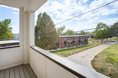 an apartment balcony with a view of a street at 3 Mi to Dtwn Denver Scenic Townhome with Deck! in Denver