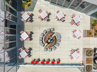 an overhead view of a table and chairs in a building at The Art Hotel Denver, Curio Collection by Hilton in Denver
