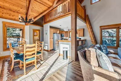 a dining room and kitchen with a table and chairs at Bright Keystone Getaway w Loft Near Ski Lifts in Keystone