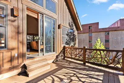 a balcony of a house with large windows at Bright Keystone Getaway w Loft Near Ski Lifts in Keystone