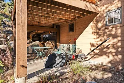 a patio with a table and chairs next to a house at Bright Keystone Getaway w Loft Near Ski Lifts in Keystone