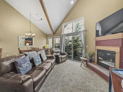 a living room with a couch and a fireplace at B6 Tarn Landing 1Br Loft, 3Ba condo in Frisco