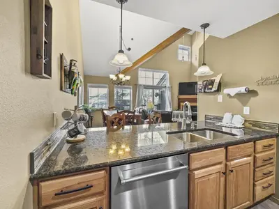 a kitchen with a sink and a counter top at B6 Tarn Landing 1Br Loft, 3Ba condo in Frisco