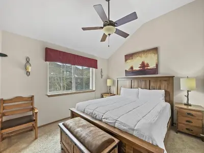 a bedroom with a bed and a ceiling fan at B6 Tarn Landing 1Br Loft, 3Ba condo in Frisco