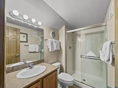 a bathroom with a sink and a shower and a toilet at B6 Tarn Landing 1Br Loft, 3Ba condo in Frisco
