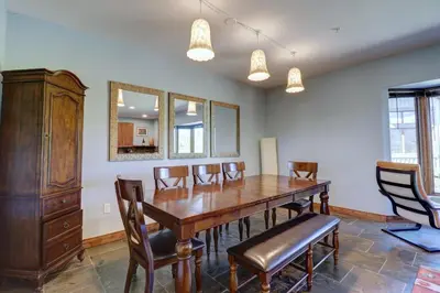 a dining room with a wooden table and chairs at A2 Marina Park 3Br 3,5Ba condo in Frisco