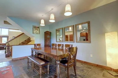 a dining room with a wooden table and chairs at A2 Marina Park 3Br 3,5Ba condo in Frisco