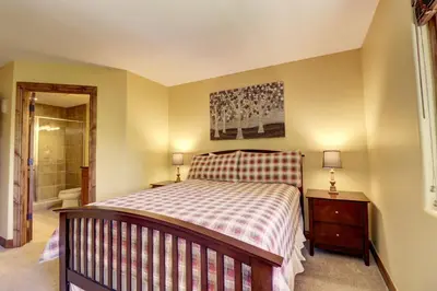 a bedroom with a bed and a walk in shower at A2 Marina Park 3Br 3,5Ba condo in Frisco