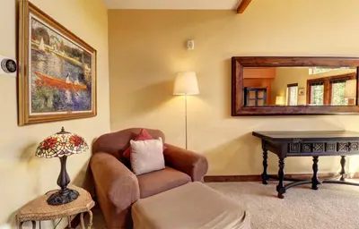 a living room with a chair and a table at A2 Marina Park 3Br 3,5Ba condo in Frisco