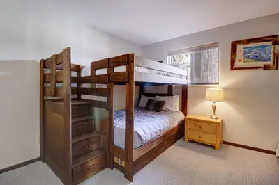 a bedroom with two bunk beds and a lamp at E101 Lake Cliffe condo in Dillon