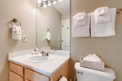 a bathroom with a sink and a mirror at 152 Ponds on the Blue River home in Silverthorne