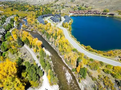 an aerial view of a lake and a road at 152 Ponds on the Blue River home in Silverthorne