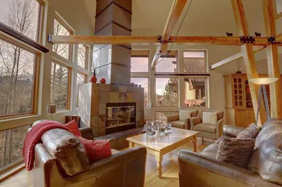 a living room with couches and a fireplace at 11 Stormwatch Circle 4Br 3,5Ba home in Silverthorne