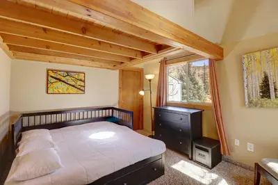 a bedroom with a bed and a window at 334 Willow Lake Ct, 4Br withloft 3Ba townhouse in Silverthorne