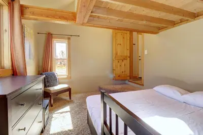 a bedroom with a bed and a desk and a chair at 334 Willow Lake Ct, 4Br withloft 3Ba townhouse in Silverthorne