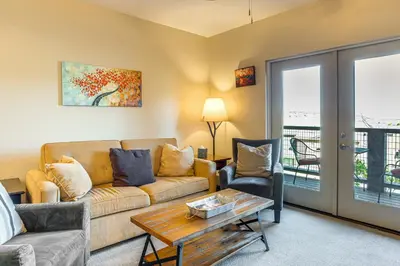a living room with a couch and two chairs and a table at Walk to Slopes Granby Condo with Balcony! in Granby