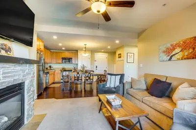 a living room with a couch and a fireplace at Walk to Slopes Granby Condo with Balcony! in Granby
