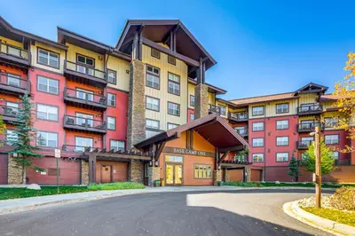 an apartment building with a road in front of it at Walk to Slopes Granby Condo with Balcony! in Granby