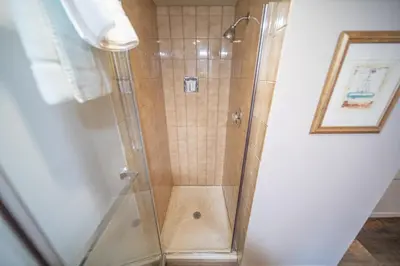 a shower with a glass door in a bathroom at Ski Run 303 by SummitCove Lodging in Keystone