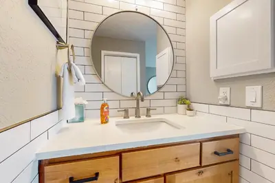 a bathroom with a sink and a mirror at Crisp Mountain Retreat in Winter Park