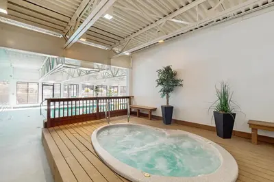 a hot tub in the middle of a room at Crisp Mountain Retreat in Winter Park