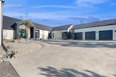 a large building with a driveway in front of it at Valley View Retreat | Main House in Tabernash