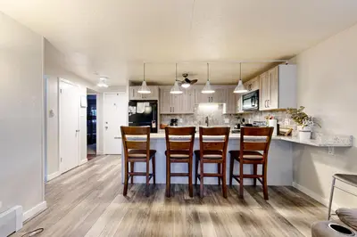 a kitchen with a table and chairs in a room at Summit Serenity in Dillon