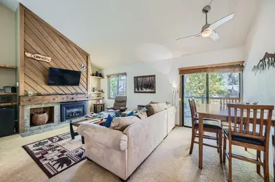 a living room with a couch and a table at 1147 Flying Dutchman condo in Keystone