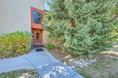 a house with a tree in front of it at 1147 Flying Dutchman condo in Keystone