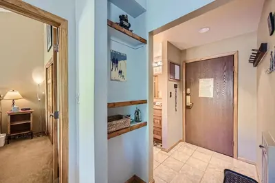 a hallway with a door leading into a room at 1147 Flying Dutchman condo in Keystone