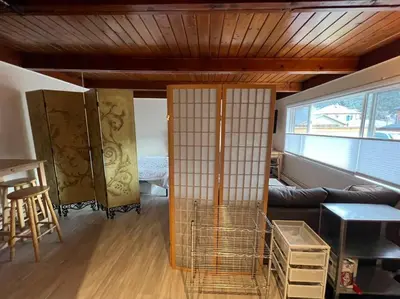 a living room with a couch and a table at Large Studio LIGHT & VIEWS - Beautiful with Deck - Message Direct in Idaho Springs