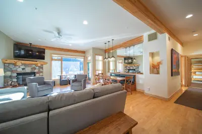 a living room with a couch and a fireplace at Mill Creek 201 by SummitCove Lodging in Keystone
