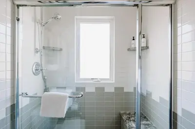 a bathroom with a shower with a glass door at Alpine Hideaway with Free Shuttle - Wildernest in Silverthorne