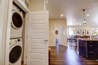 a kitchen and living room with a washer and dryer at Sail Lofts 101 condo in Dillon