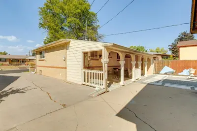a small house with a porch on a street at 6 Mi to Dtwn Denver Escape with Fire Pit in Denver